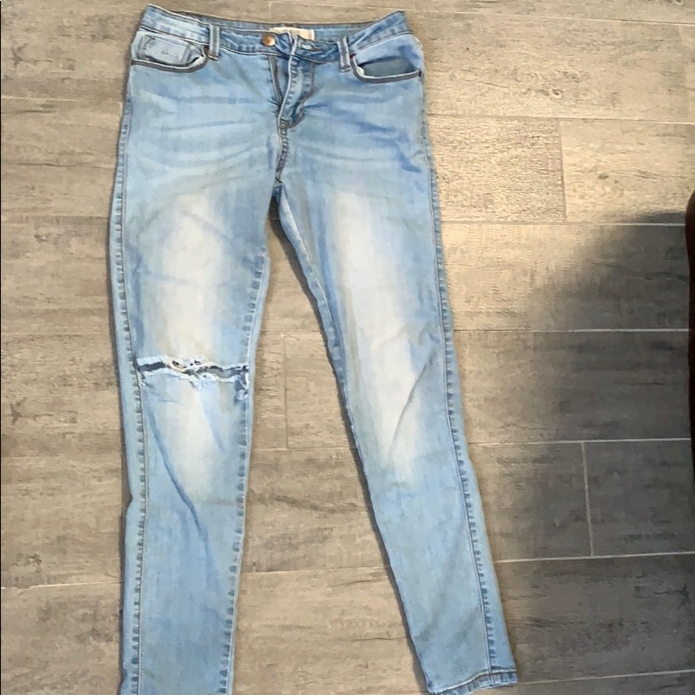 light blue ripped jeans